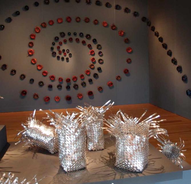 Maile Andrade, Ka Huli, 2013, wall installation with lauhala baskets